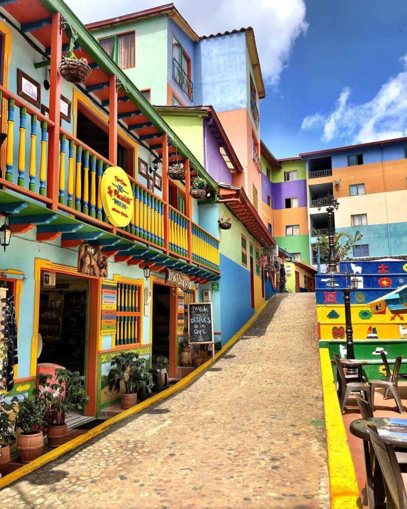 Vibrant colorful street in Guatapé Colombia with painted colonial buildings and cobblestone road