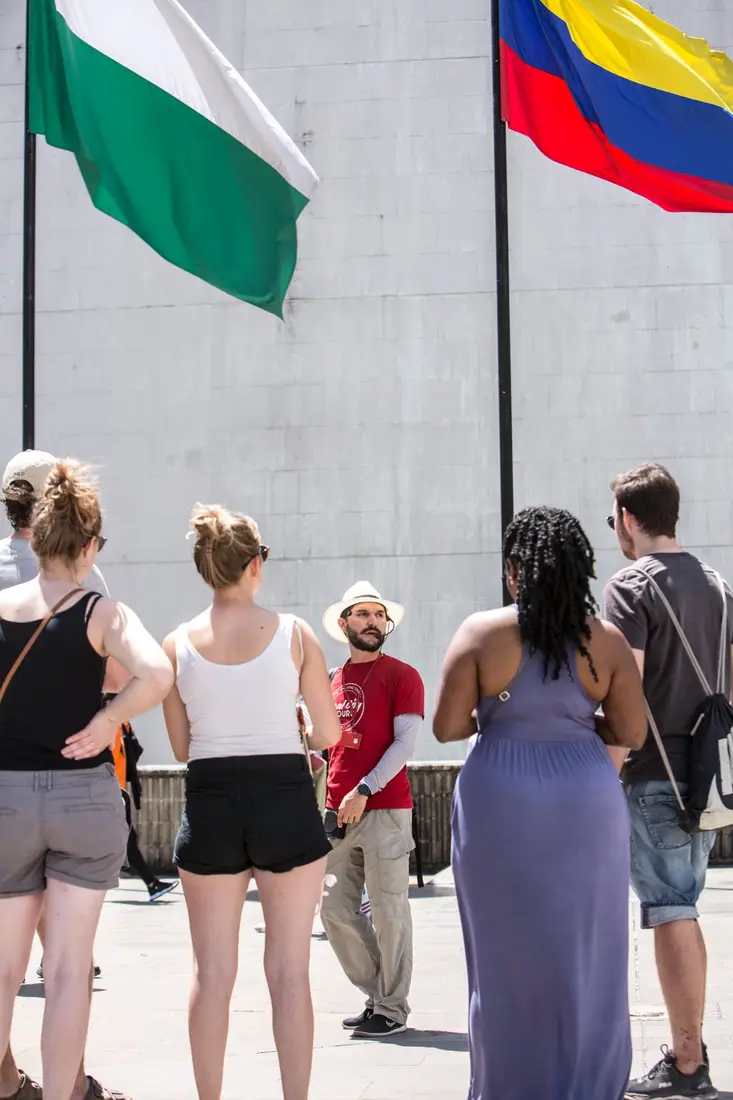 free-walking-tour-medellin-local-guide-flags